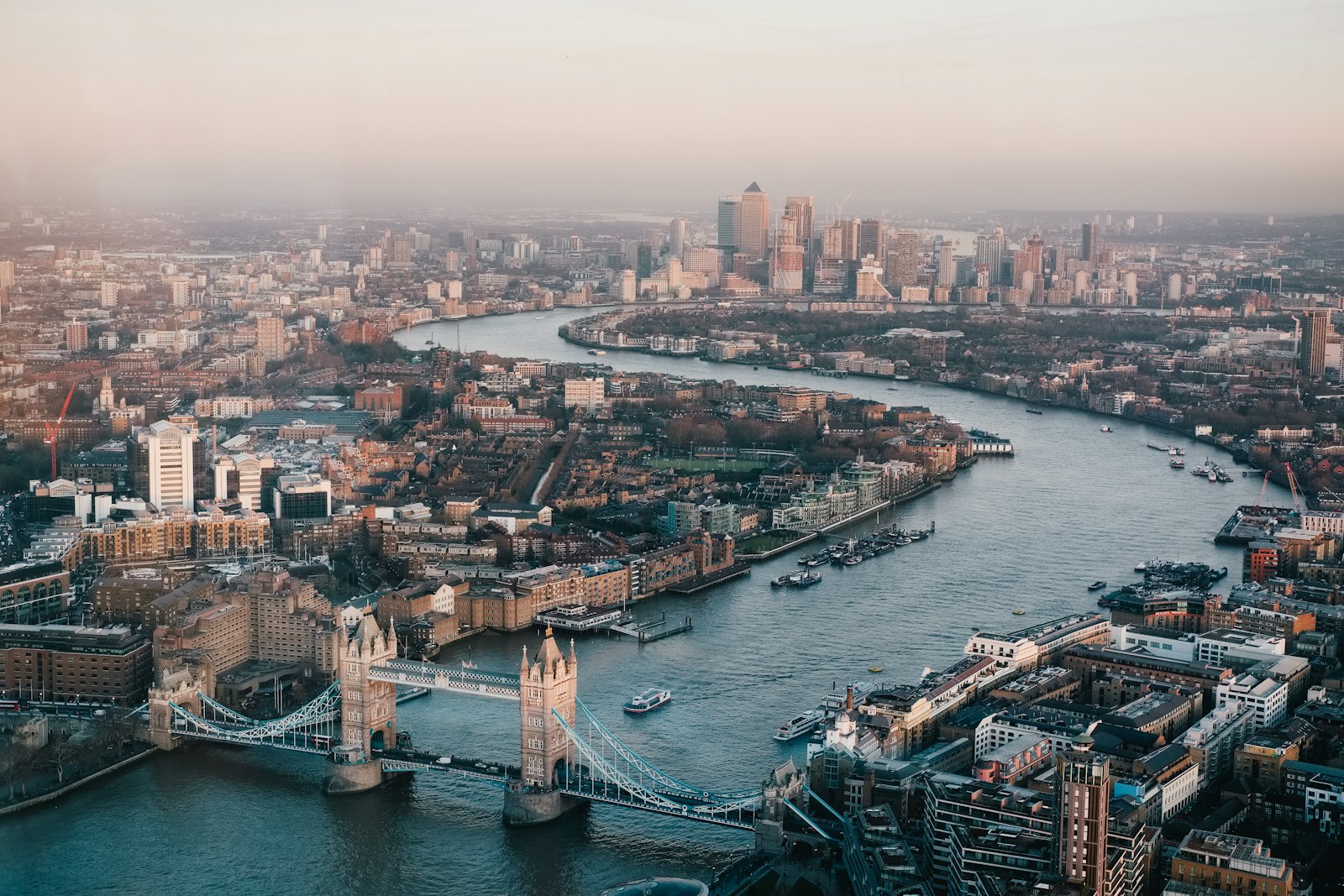 London from above: the Thames curving past Tower Bridge towards Canary Wharf
